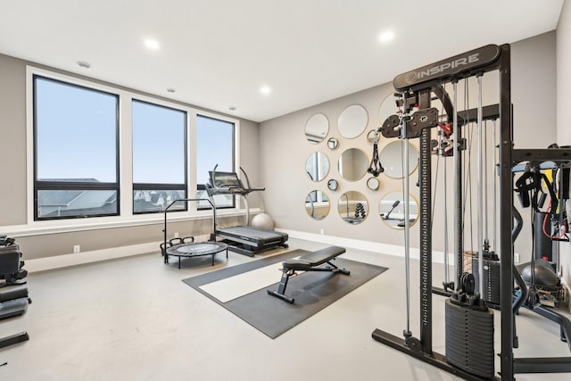 exercise area featuring recessed lighting and baseboards