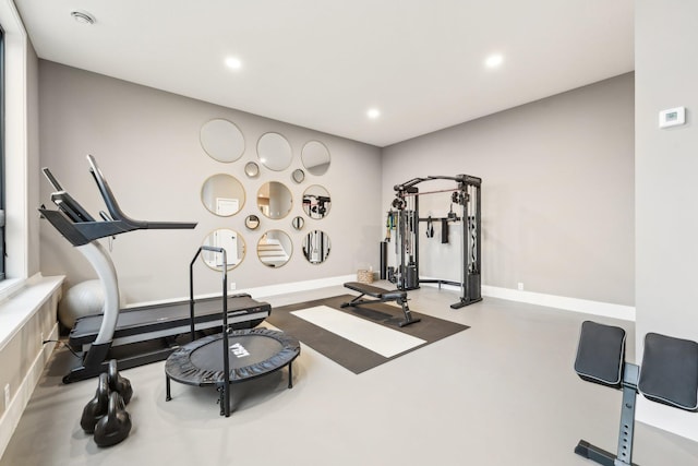 exercise area featuring recessed lighting and baseboards