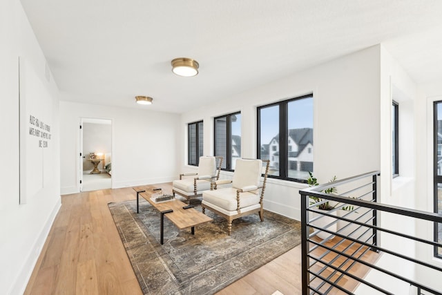 interior space with light wood-type flooring and baseboards