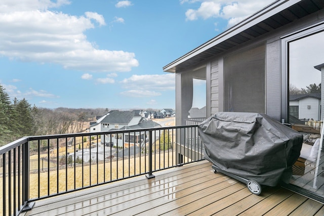 deck featuring a residential view and grilling area