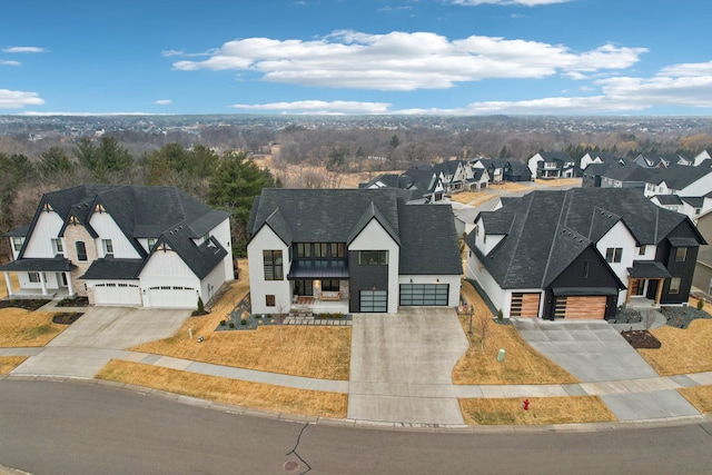 birds eye view of property with a residential view