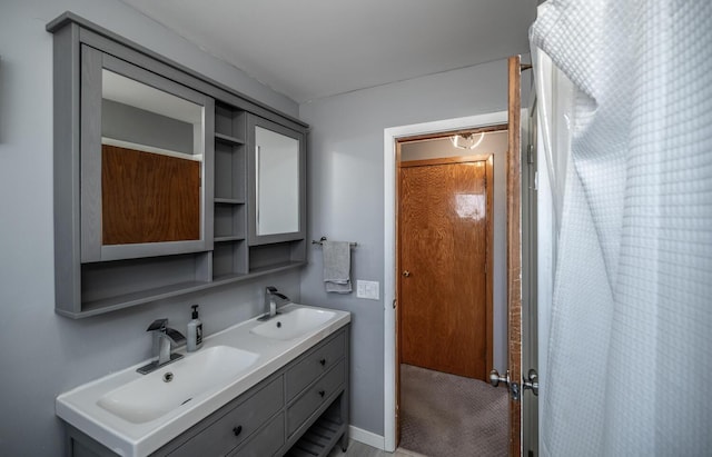 full bath with double vanity, a sink, and a shower with shower curtain