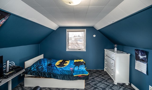 bedroom with lofted ceiling