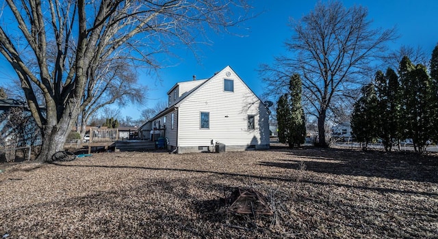 view of side of property with a wooden deck