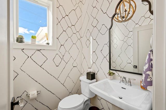 bathroom featuring toilet and a sink