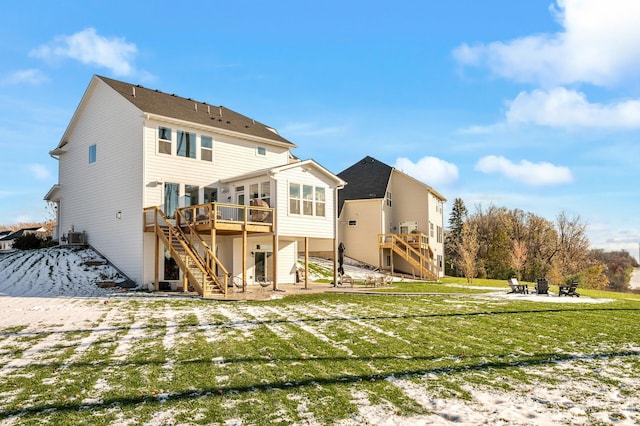 rear view of property with a deck, a yard, a patio, and stairway