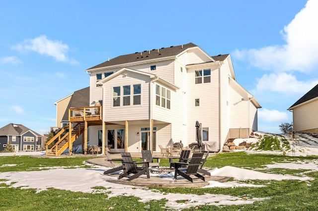 back of house with a patio area, an outdoor fire pit, stairs, and a wooden deck