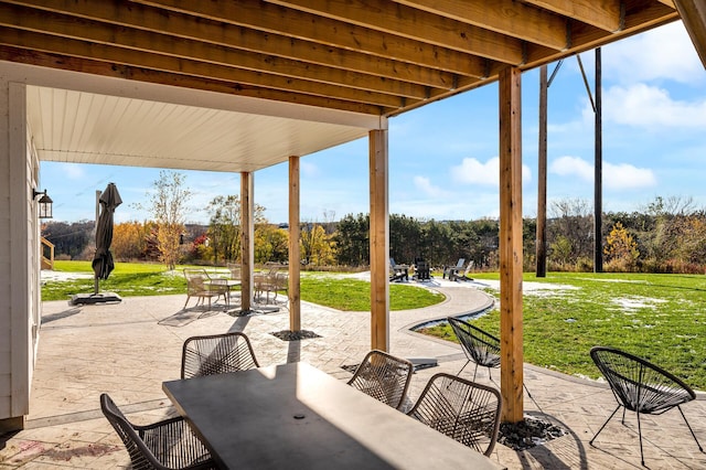 view of patio featuring outdoor dining area