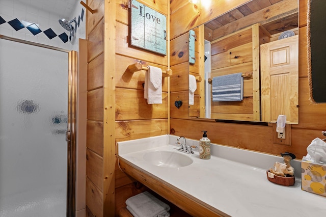 full bathroom featuring a shower stall and a sink