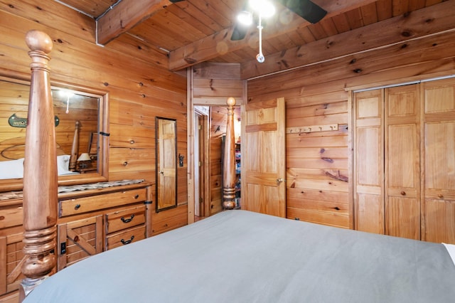 bedroom featuring wooden ceiling, beamed ceiling, and wooden walls