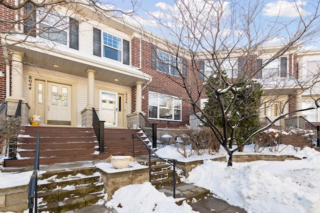 townhome / multi-family property with brick siding