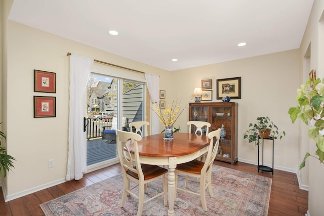 dining space featuring recessed lighting, baseboards, and hardwood / wood-style flooring