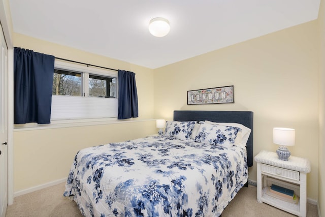 carpeted bedroom with baseboards