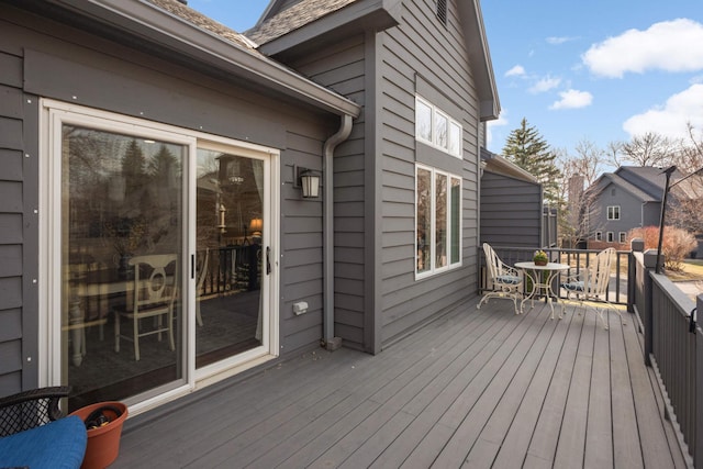 wooden deck featuring outdoor dining space
