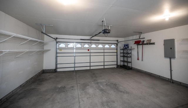 garage with electric panel and a garage door opener