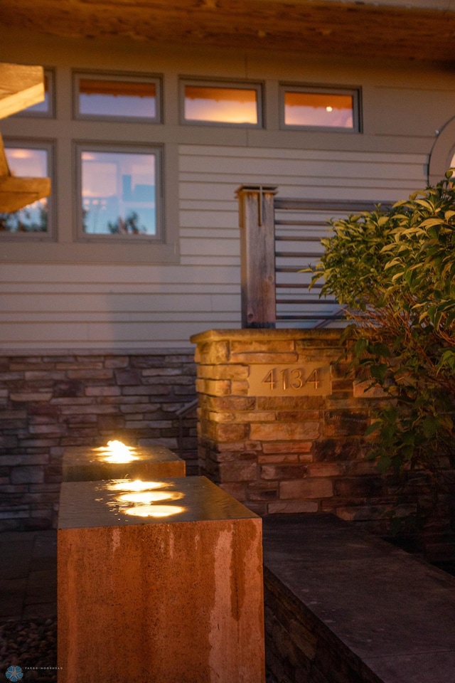 exterior details featuring stone siding