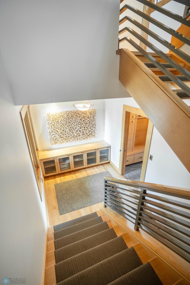 stairway with wood finished floors