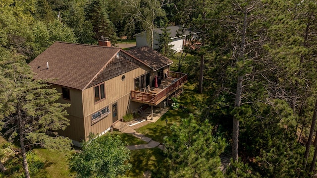 drone / aerial view featuring a forest view