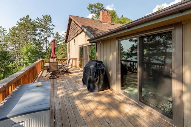 deck featuring area for grilling and outdoor dining space