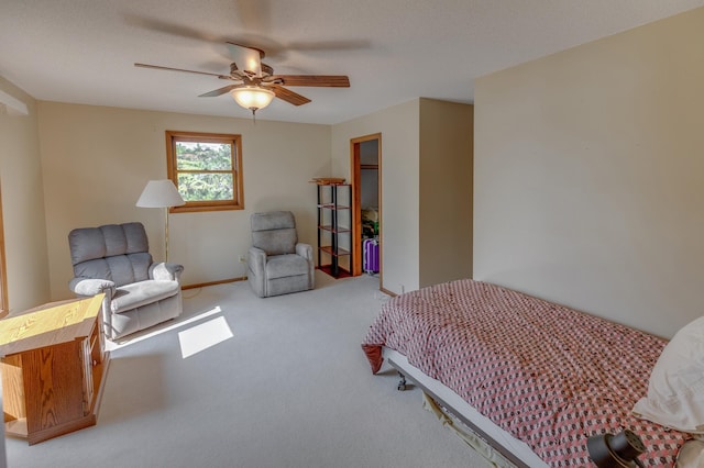 carpeted bedroom featuring ceiling fan and baseboards