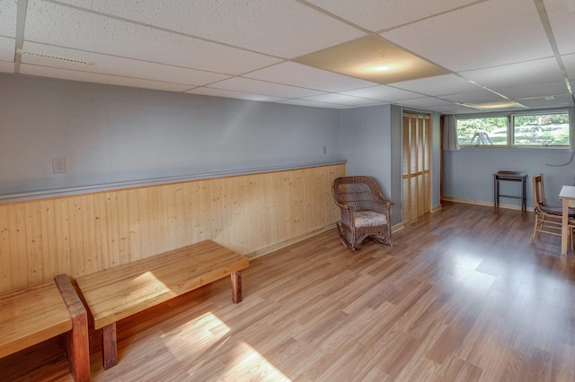 unfurnished room featuring a paneled ceiling and wood finished floors