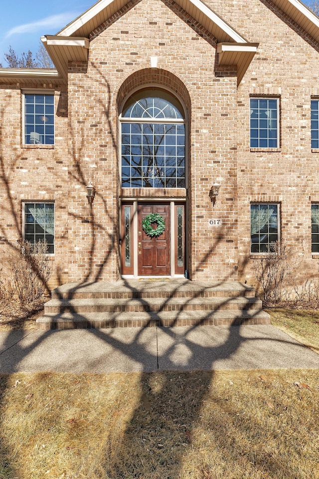 entrance to property with brick siding