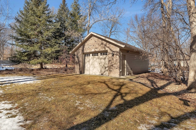 detached garage featuring driveway