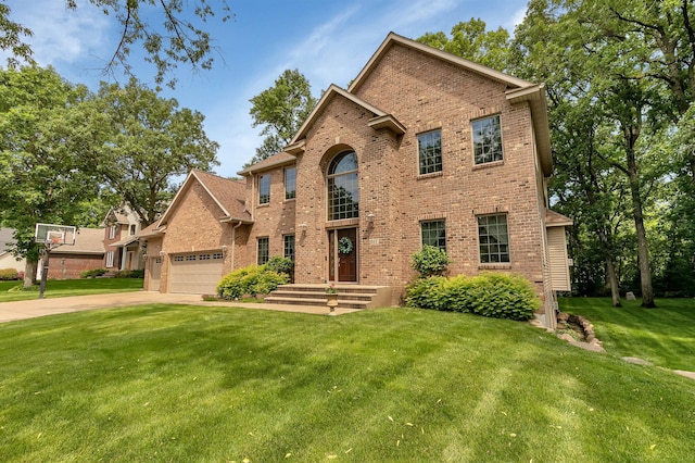 617 17th St N, Sartell, MN 56377 - traditional-style home featuring brick siding, a front lawn, driveway, and a garage