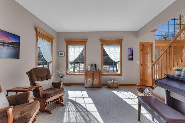 617 17th St N, Sartell, MN 56377 - sitting room featuring stairway, baseboards, and carpet