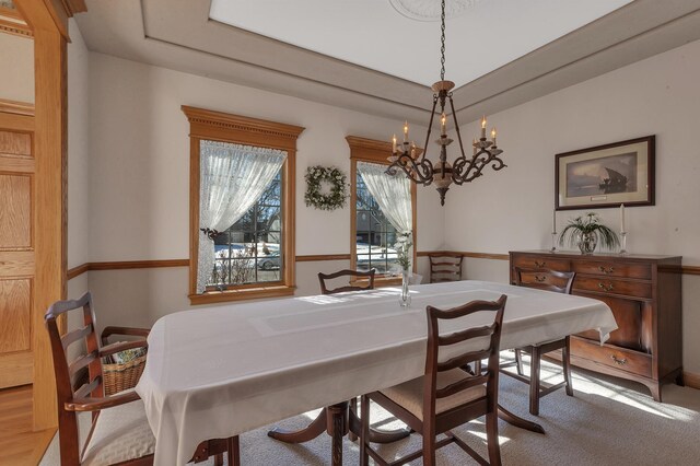 617 17th St N, Sartell, MN 56377 - carpeted dining area featuring a chandelier