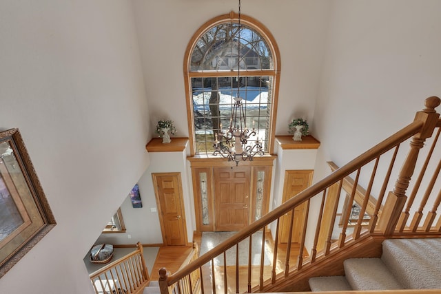 617 17th St N, Sartell, MN 56377 - foyer with a high ceiling, wood finished floors, a chandelier, and stairway