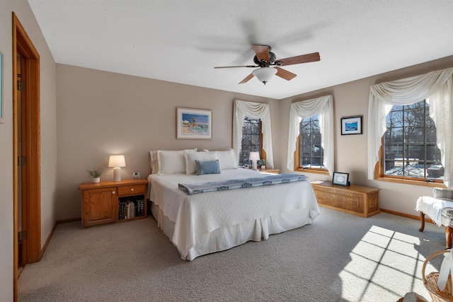 617 17th St N, Sartell, MN 56377 - bedroom with light colored carpet, baseboards, and a ceiling fan
