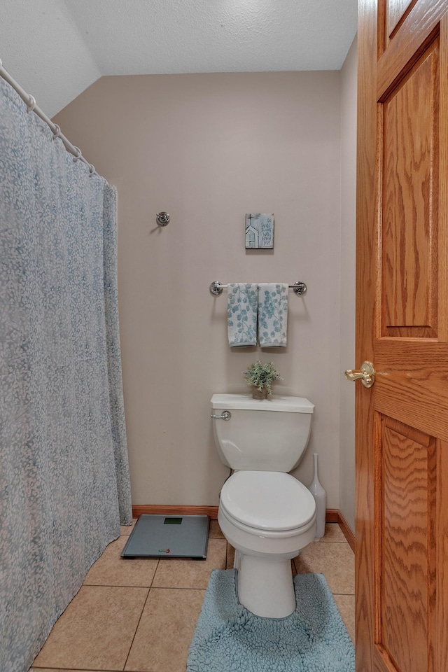 617 17th St N, Sartell, MN 56377 - bathroom featuring toilet, tile patterned floors, baseboards, and a shower with curtain
