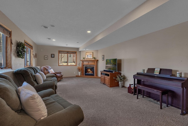 617 17th St N, Sartell, MN 56377 - living area featuring light carpet, a glass covered fireplace, and recessed lighting