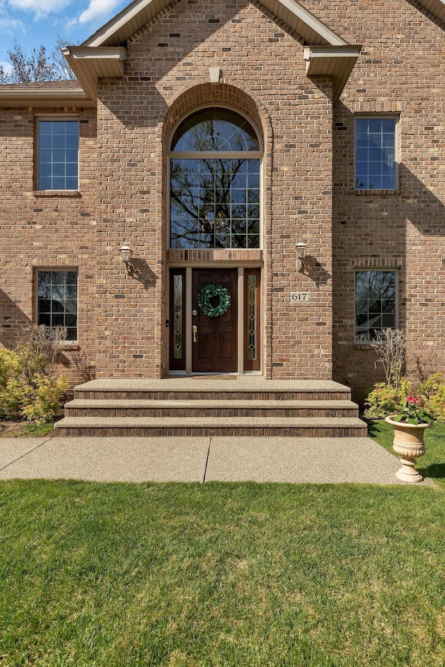 617 17th St N, Sartell, MN 56377 - entrance to property featuring brick siding and a lawn