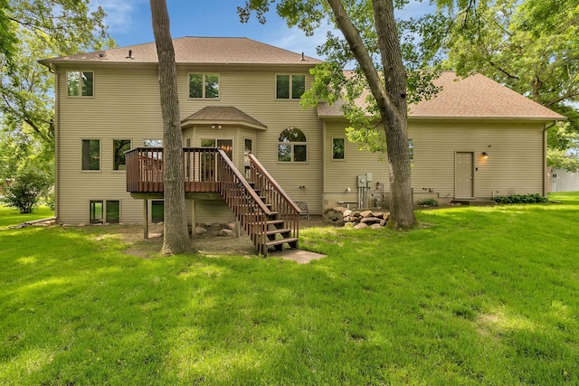 617 17th St N, Sartell, MN 56377 - back of house with a deck, stairs, a lawn, and roof with shingles