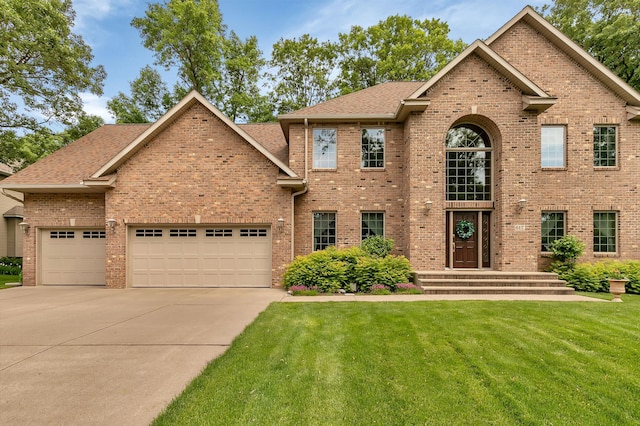 617 17th St N, Sartell, MN 56377 - view of front of home featuring a front lawn, driveway, an attached garage, and roof with shingles