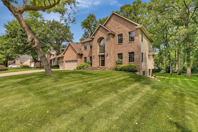 617 17th St N, Sartell, MN 56377 - traditional-style home featuring brick siding, a front lawn, and a garage