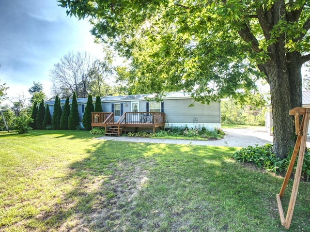 exterior space featuring a wooden deck and a front lawn