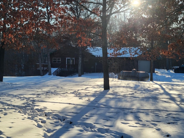 view of yard layered in snow