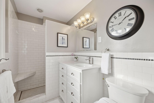 bathroom featuring toilet, a walk in shower, tile walls, and wainscoting