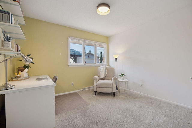 sitting room with carpet flooring and baseboards