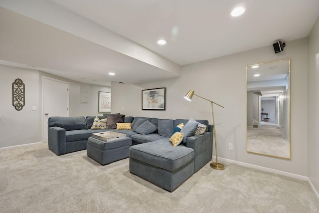 carpeted living room with recessed lighting and baseboards