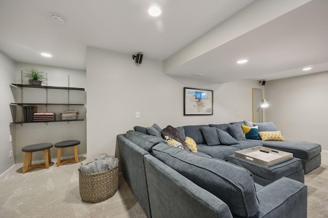 carpeted living area featuring baseboards and recessed lighting