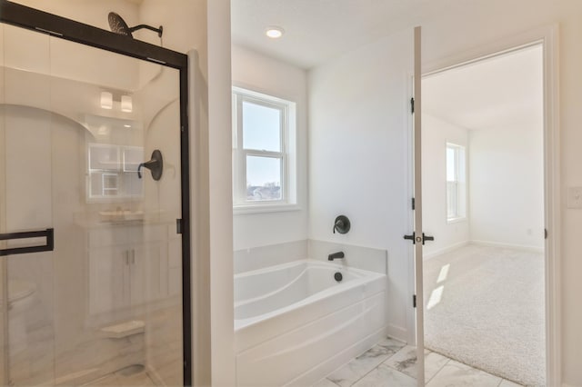 full bath with marble finish floor, a shower stall, baseboards, and a bath