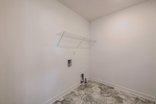 laundry room with hookup for a washing machine, laundry area, gas dryer hookup, and baseboards