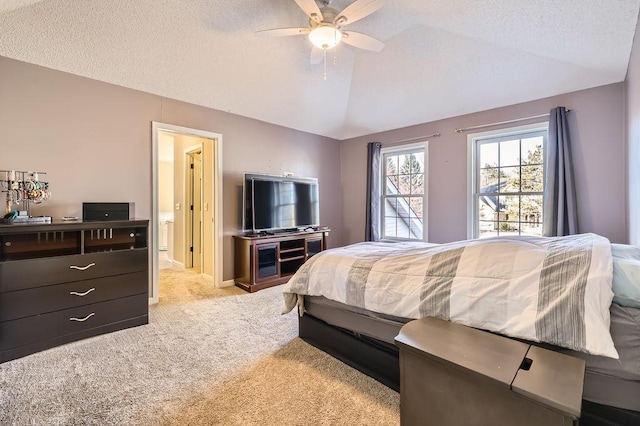 bedroom with baseboards, light colored carpet, ceiling fan, vaulted ceiling, and a textured ceiling