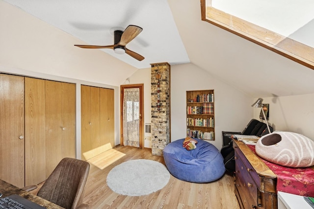 sitting room featuring lofted ceiling, ceiling fan, and wood finished floors