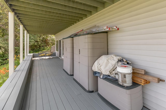 wooden deck featuring outdoor dining area