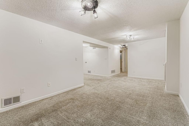 11570 Juniper St NW, Coon Rapids, MN 55448 - empty room featuring a textured ceiling and light carpet